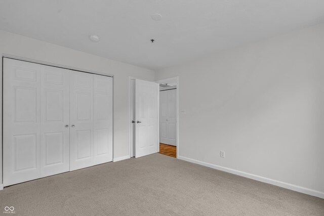8176 Shorewalk Dr Unit C, Indianapolis, IN 46236 - unfurnished bedroom featuring carpet and a closet