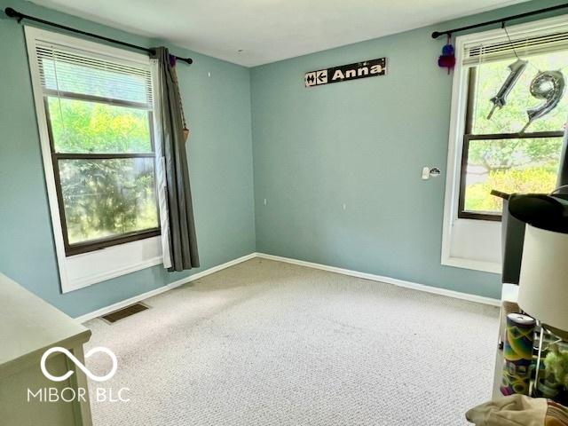 1802 Laurel Dr, Columbus, IN 47203 - empty room with carpet flooring and baseboards