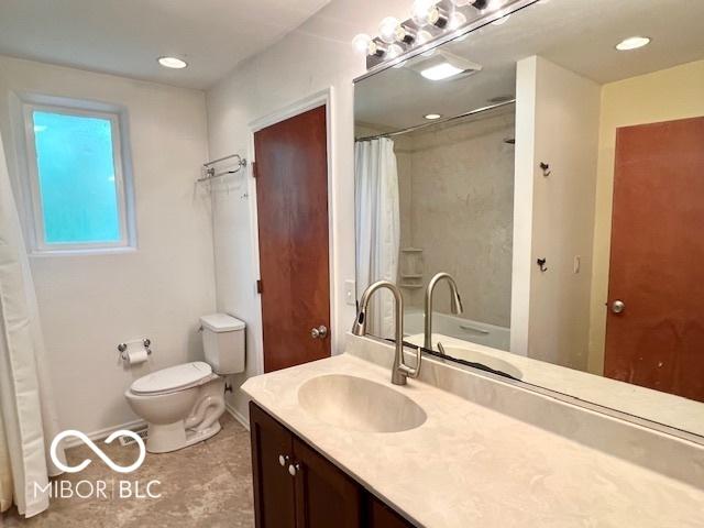 1802 Laurel Dr, Columbus, IN 47203 - full bathroom with vanity, curtained shower, and recessed lighting