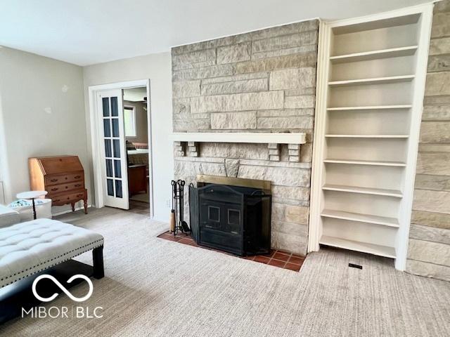 1802 Laurel Dr, Columbus, IN 47203 - carpeted living area with a fireplace