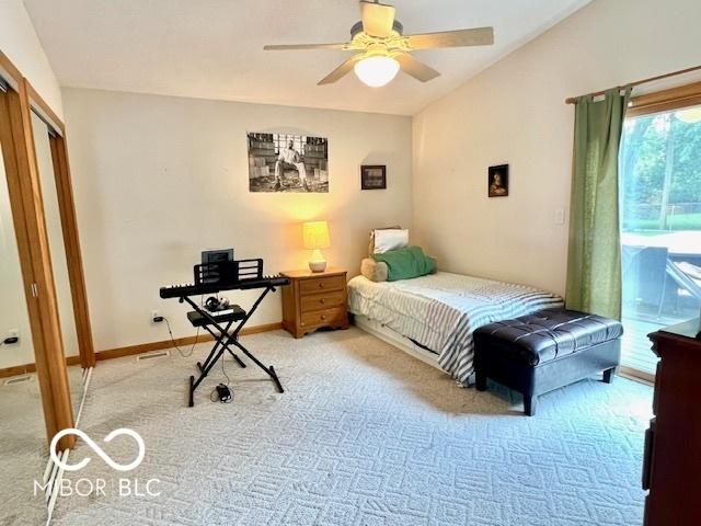 1802 Laurel Dr, Columbus, IN 47203 - bedroom with light carpet, access to outside, vaulted ceiling, and a ceiling fan