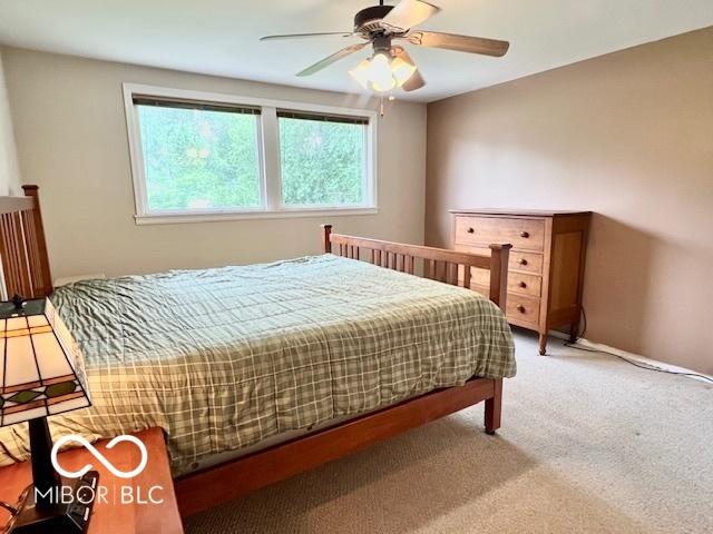 1802 Laurel Dr, Columbus, IN 47203 - carpeted bedroom with ceiling fan