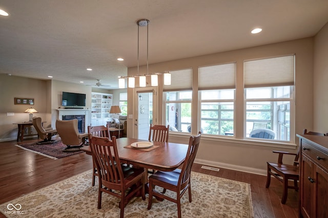 16209 Natures Way, Westfield, IN 46074 - dining room with a premium fireplace, recessed lighting, dark wood-style floors, and healthy amount of natural light