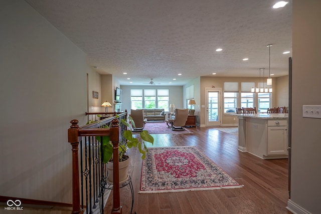 16209 Natures Way, Westfield, IN 46074 - living area featuring wood finished floors, recessed lighting, and a textured ceiling