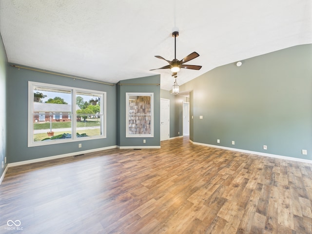 114 Bluebird Ln, Sulphur Springs, IN 47388 - empty room with vaulted ceiling, ceiling fan, wood finished floors, and baseboards