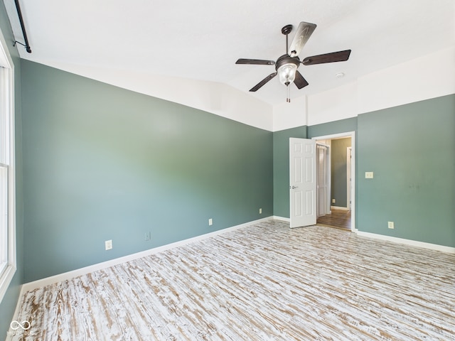 114 Bluebird Ln, Sulphur Springs, IN 47388 - spare room featuring ceiling fan, lofted ceiling, baseboards, and wood finished floors