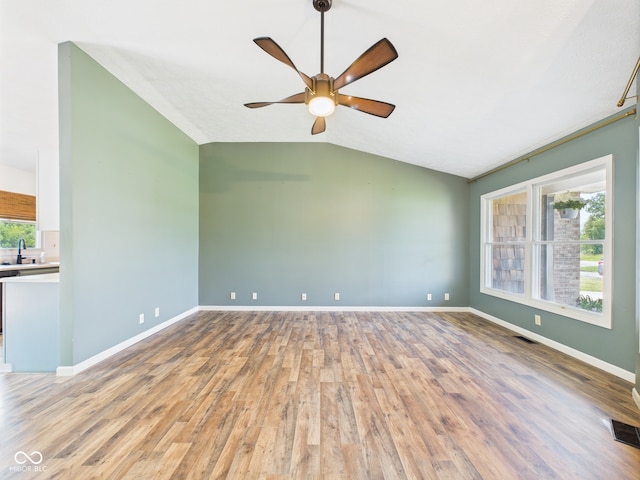 114 Bluebird Ln, Sulphur Springs, IN 47388 - unfurnished room with vaulted ceiling, light wood-type flooring, a ceiling fan, baseboards, and a sink