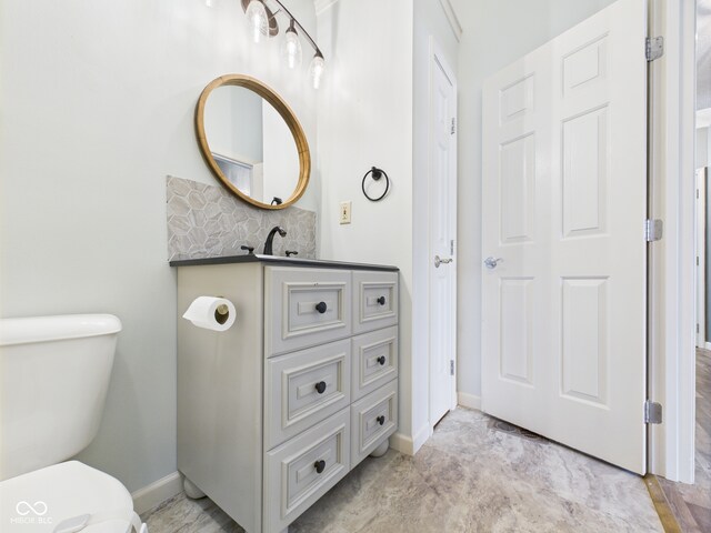 114 Bluebird Ln, Sulphur Springs, IN 47388 - half bath with toilet, baseboards, decorative backsplash, and vanity