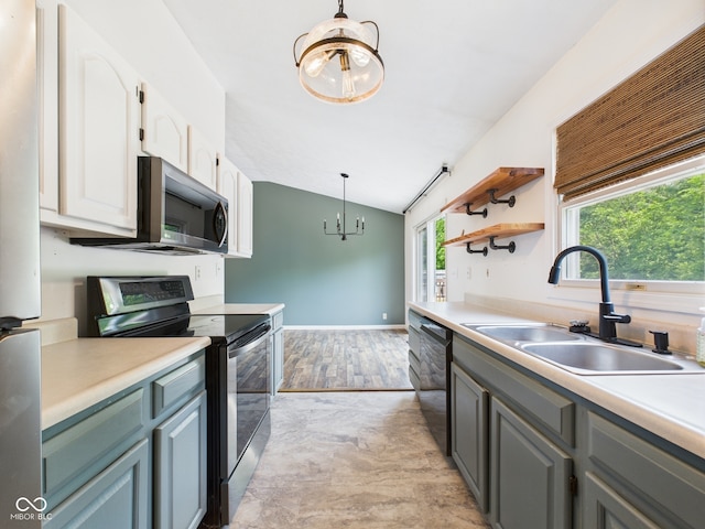 114 Bluebird Ln, Sulphur Springs, IN 47388 - kitchen with stainless steel appliances, a chandelier, a sink, pendant lighting, and lofted ceiling