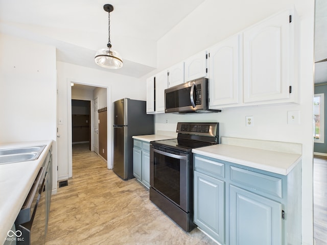 114 Bluebird Ln, Sulphur Springs, IN 47388 - kitchen with appliances with stainless steel finishes, white cabinets, decorative light fixtures, light countertops, and a sink