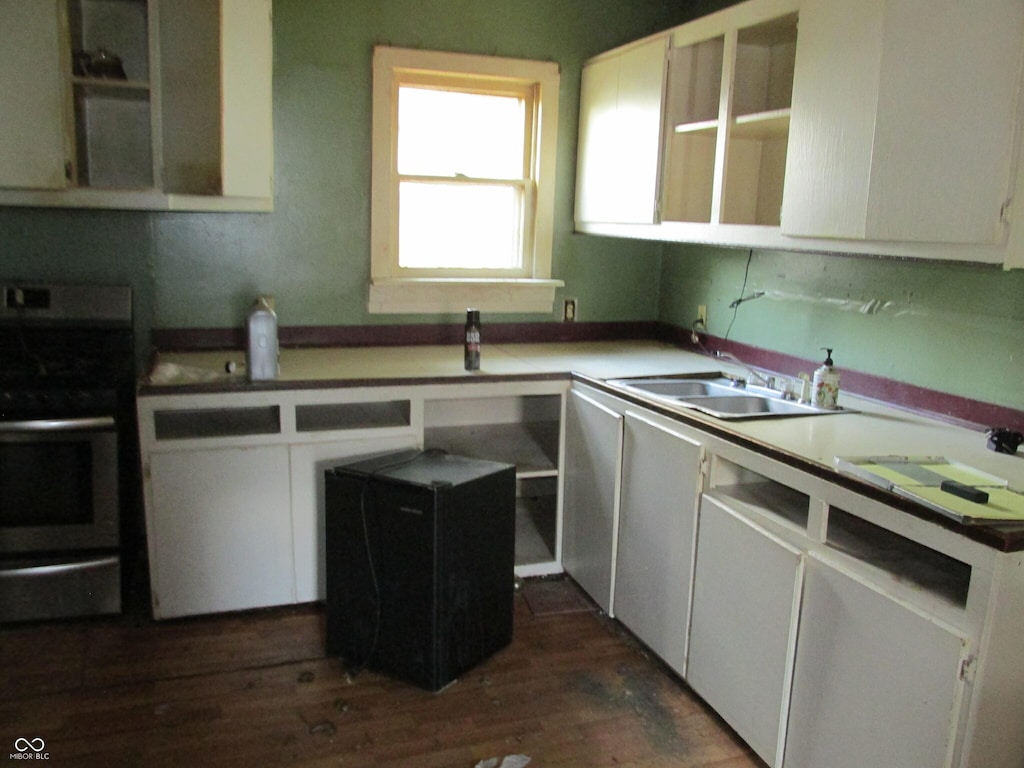 121 School St, Greenfield, IN 46140 - kitchen featuring electric stove, dark wood-style flooring, and white cabinets