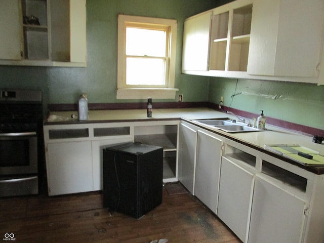 121 School St, Greenfield, IN 46140 - kitchen featuring electric stove, dark wood-style flooring, and white cabinets
