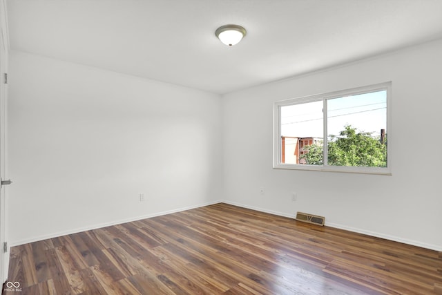 2642 Country Estates Dr, Indianapolis, IN 46227 - unfurnished room with dark wood finished floors and baseboards