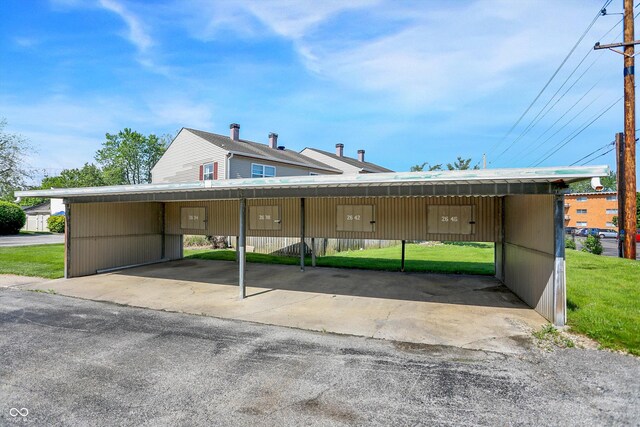 2642 Country Estates Dr, Indianapolis, IN 46227 - view of front of home featuring a carport and a front yard
