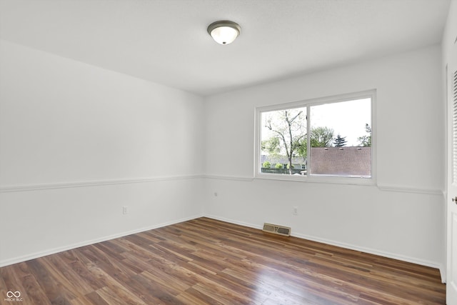 2642 Country Estates Dr, Indianapolis, IN 46227 - unfurnished room with wood finished floors and baseboards