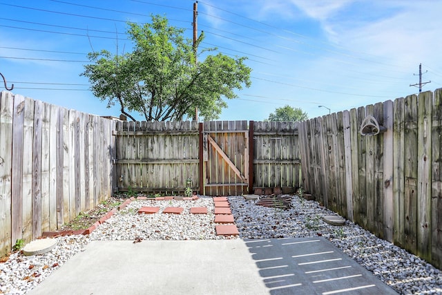2642 Country Estates Dr, Indianapolis, IN 46227 - fenced backyard featuring a gate and a patio