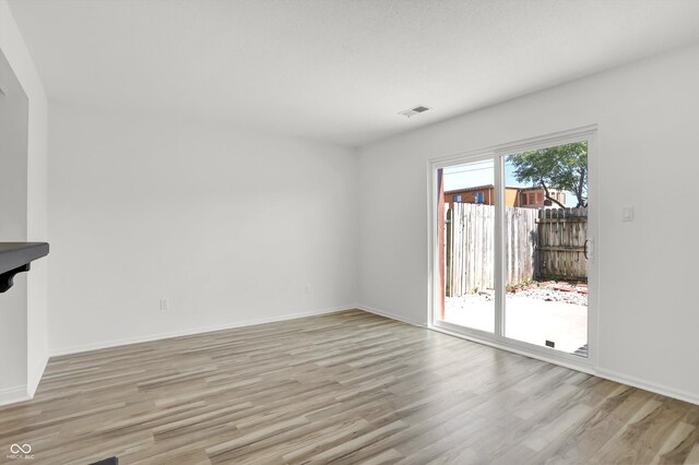 2642 Country Estates Dr, Indianapolis, IN 46227 - spare room with light wood-type flooring and baseboards