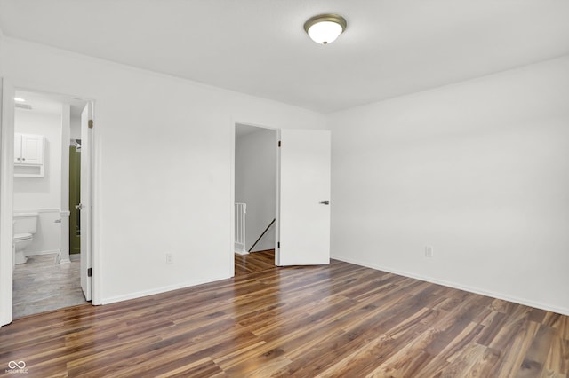 2642 Country Estates Dr, Indianapolis, IN 46227 - spare room featuring wood finished floors and baseboards