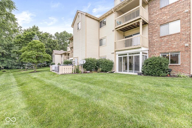 1044 Timber Creek Dr Unit 2, Carmel, IN 46032 - rear view of house featuring a yard, a chimney, and brick siding