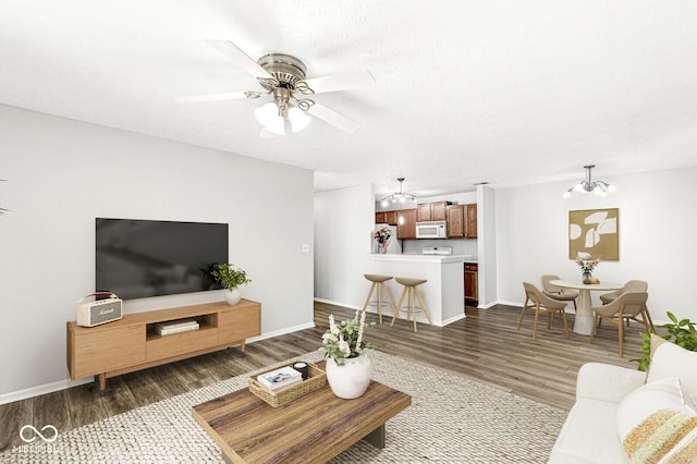1044 Timber Creek Dr Unit 2, Carmel, IN 46032 - living area featuring dark wood finished floors, ceiling fan, and a chandelier