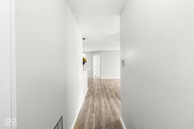 1044 Timber Creek Dr Unit 2, Carmel, IN 46032 - hall featuring wood finished floors and baseboards
