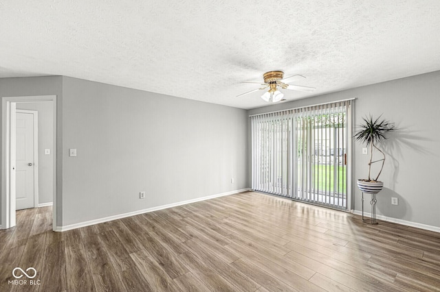 1044 Timber Creek Dr Unit 2, Carmel, IN 46032 - empty room with a ceiling fan, wood finished floors, and a textured ceiling