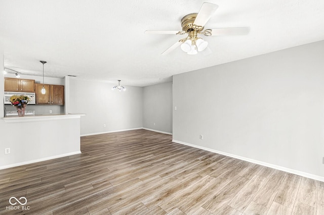 1044 Timber Creek Dr Unit 2, Carmel, IN 46032 - unfurnished living room featuring wood finished floors and ceiling fan