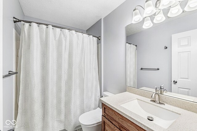 1044 Timber Creek Dr Unit 2, Carmel, IN 46032 - bathroom with vanity, a textured ceiling, and curtained shower
