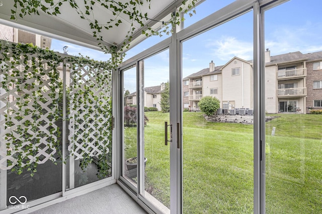1044 Timber Creek Dr Unit 2, Carmel, IN 46032 - unfurnished sunroom with plenty of natural light and a residential view