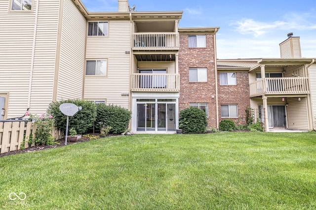 1044 Timber Creek Dr Unit 2, Carmel, IN 46032 - rear view of house featuring a yard, a chimney, and brick siding