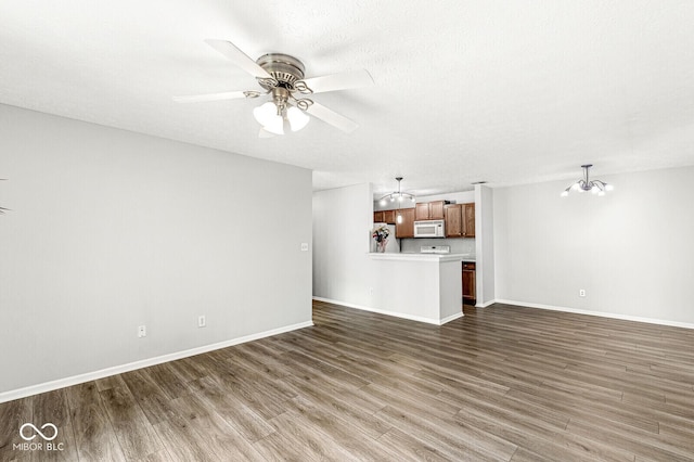 1044 Timber Creek Dr Unit 2, Carmel, IN 46032 - unfurnished living room with ceiling fan, wood finished floors, and a chandelier