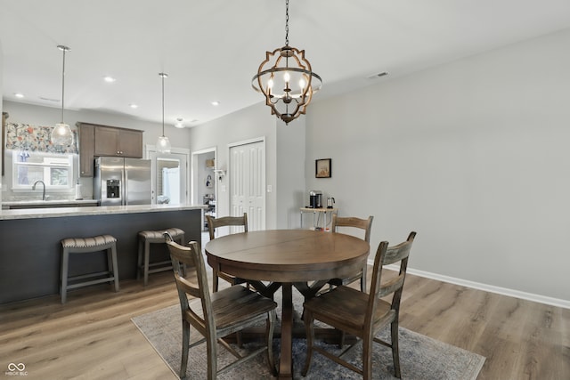 3613 Lehigh Ave, Westfield, IN 46074 - dining space with a chandelier, light wood-style flooring, and recessed lighting
