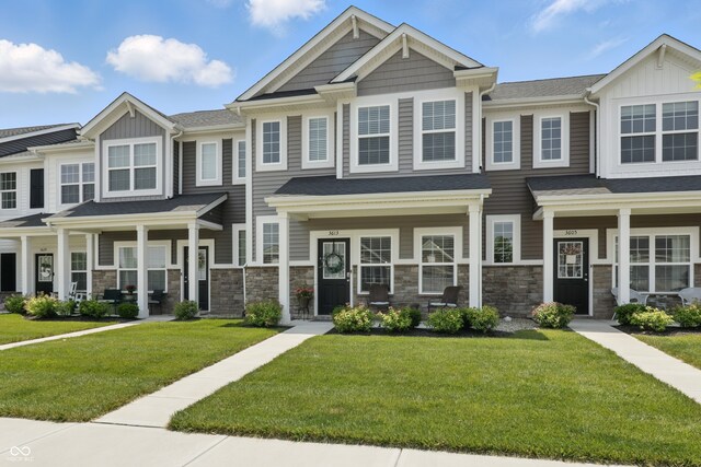 3613 Lehigh Ave, Westfield, IN 46074 - townhome / multi-family property featuring a front lawn, board and batten siding, covered porch, and stone siding