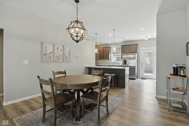 3613 Lehigh Ave, Westfield, IN 46074 - dining space with light wood-style floors, a chandelier, and recessed lighting