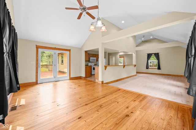 5800 S Shore Dr, Nashville, IN 47448 - unfurnished living room with ceiling fan, plenty of natural light, light wood finished floors, recessed lighting, and high vaulted ceiling