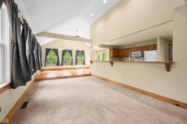 5800 S Shore Dr, Nashville, IN 47448 - unfurnished living room with light carpet, vaulted ceiling, recessed lighting, and ceiling fan