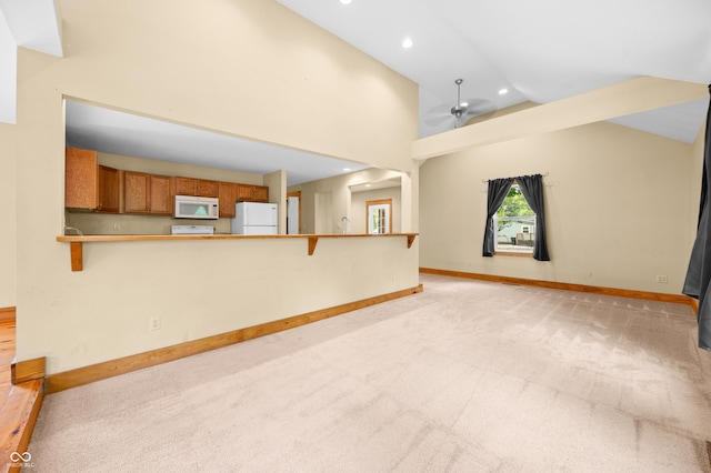 5800 S Shore Dr, Nashville, IN 47448 - unfurnished living room with light carpet, a ceiling fan, recessed lighting, and high vaulted ceiling