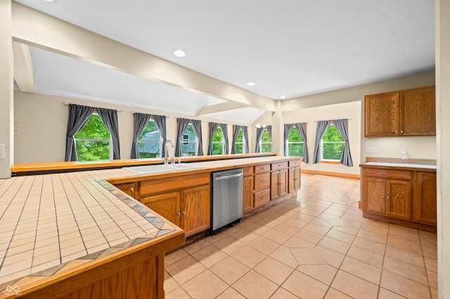 5800 S Shore Dr, Nashville, IN 47448 - kitchen featuring dishwasher, tile countertops, light tile patterned flooring, brown cabinetry, and recessed lighting