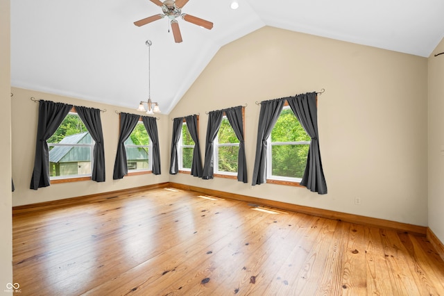 5800 S Shore Dr, Nashville, IN 47448 - unfurnished room featuring lofted ceiling, light wood-type flooring, ceiling fan, and a chandelier