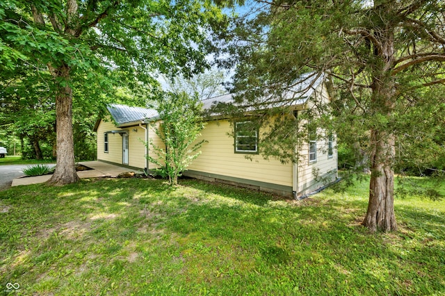 5800 S Shore Dr, Nashville, IN 47448 - view of side of home featuring a metal roof and a lawn