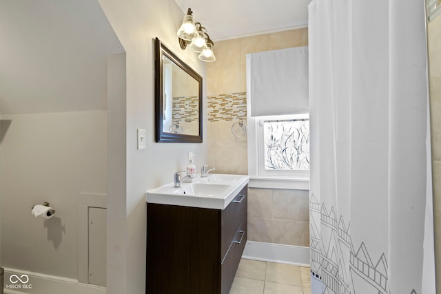 4813 E 11th St, Indianapolis, IN 46201 - bathroom with vanity, tile patterned flooring, and tile walls