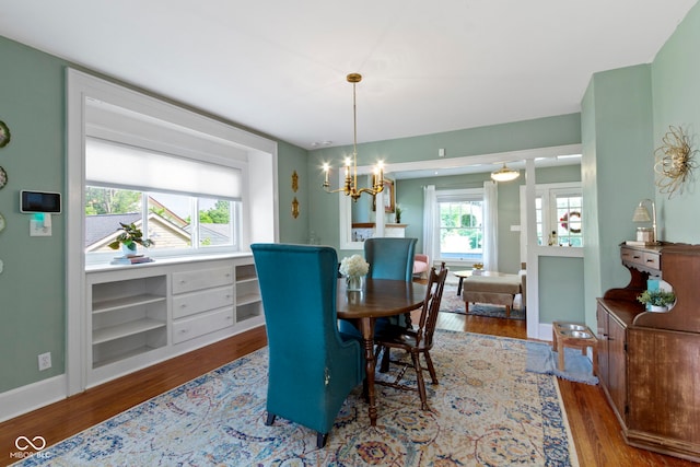 4813 E 11th St, Indianapolis, IN 46201 - dining room with wood finished floors and a chandelier
