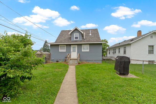 4813 E 11th St, Indianapolis, IN 46201 - back of property featuring a fenced backyard and roof with shingles