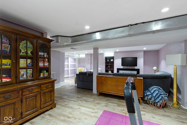 4813 E 11th St, Indianapolis, IN 46201 - living room featuring light wood-type flooring and recessed lighting