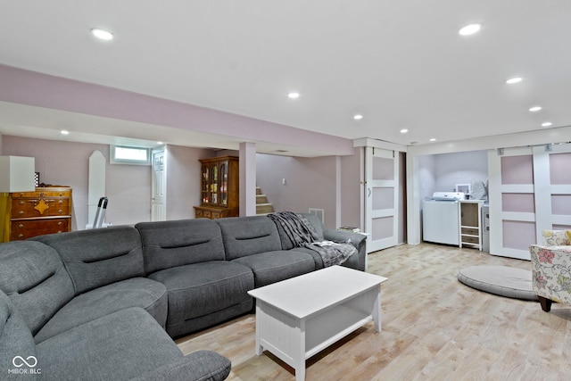 4813 E 11th St, Indianapolis, IN 46201 - living area featuring washer / clothes dryer, light wood-style floors, stairway, and recessed lighting