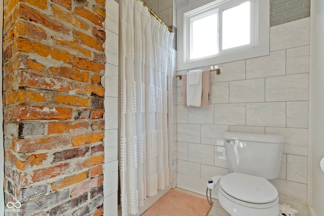 4813 E 11th St, Indianapolis, IN 46201 - full bath with tile walls and a shower with shower curtain
