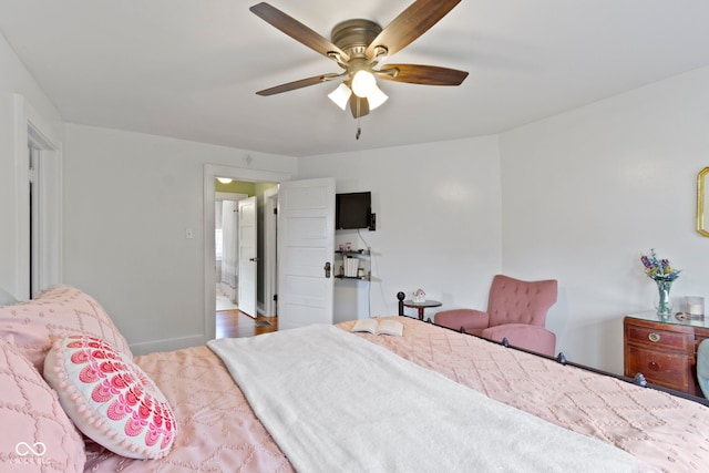 4813 E 11th St, Indianapolis, IN 46201 - bedroom with a ceiling fan and baseboards