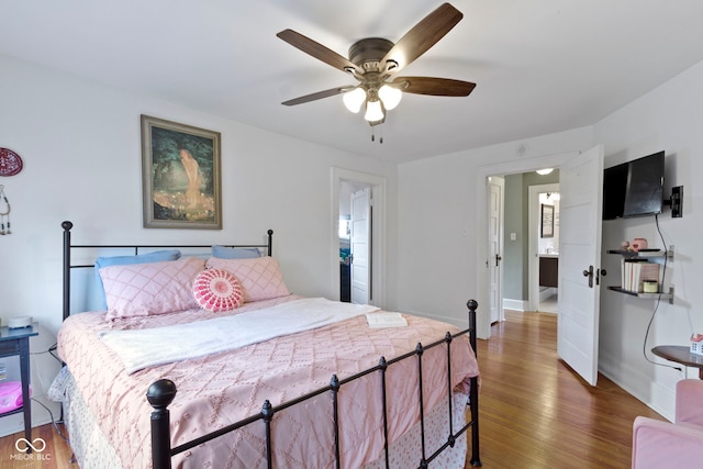 4813 E 11th St, Indianapolis, IN 46201 - bedroom with wood finished floors and a ceiling fan