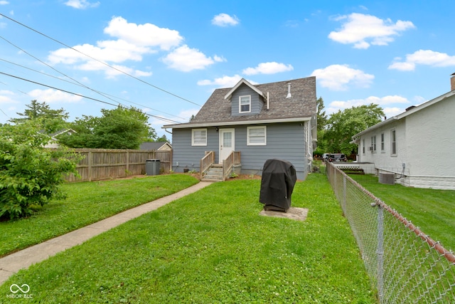 4813 E 11th St, Indianapolis, IN 46201 - rear view of house with a fenced backyard and a shingled roof