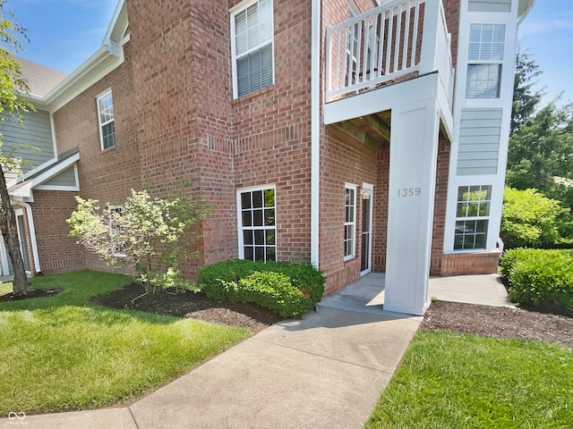 1359 Shadow Ridge Rd, Indianapolis, IN 46280 - property entrance with a balcony and brick siding
